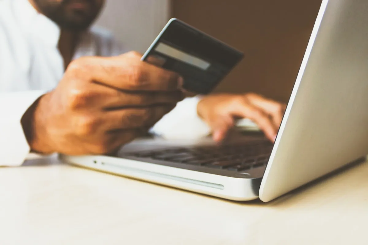 Small business owner setting up a digital loyalty program on a laptop